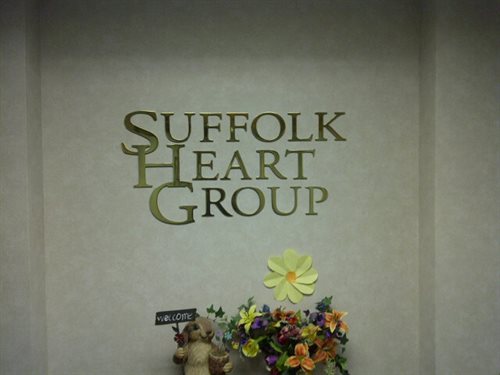 Medical practice sign, Water jet cut, 1/4" thick, Polished brass Logo, installed in the reception area, logo wall  Installed Village of the Branch , T